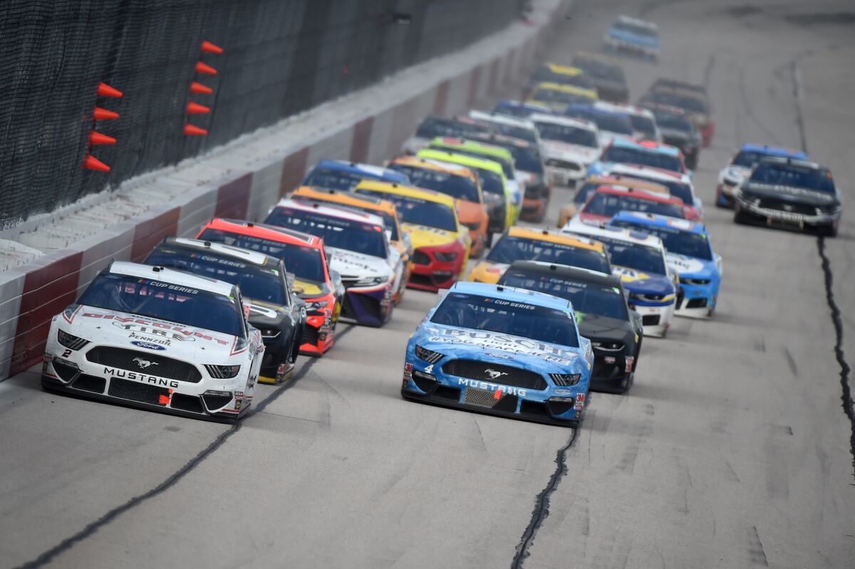 Brad Keselowski (#2) leads the pack