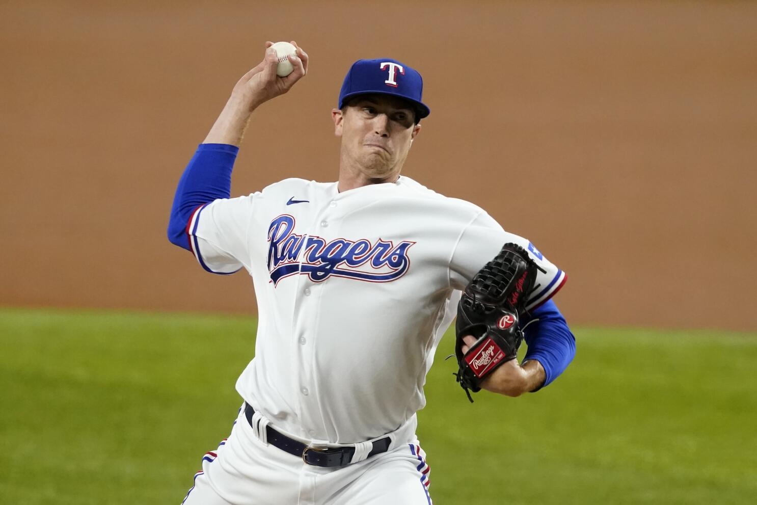 Texas Rangers catcher Jose Trevino, left, and relief pitcher Ian