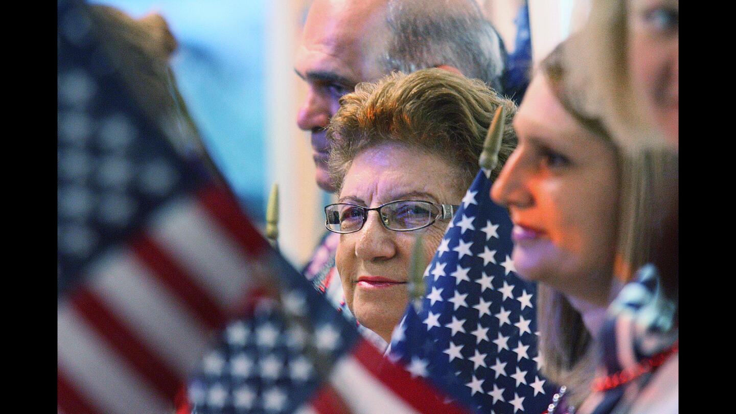 Nghshoon Nazarian stands with her classmates after the group was recognized for obtaining their U.S. citizenship during a ceremony at the Glendale Community College Garfield campus on Thursday, April 21, 2016.