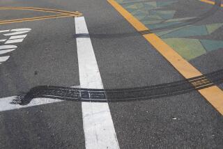 Tire burn marks can be seen where a fatal collision occurred Sunday evening, where a 12-year-old bicyclist collided with a moving truck operated by an impaired driver at the crosswalk at Junipero and Arlington Drives in Costa Mesa. Two were arrested and police are investigating.
