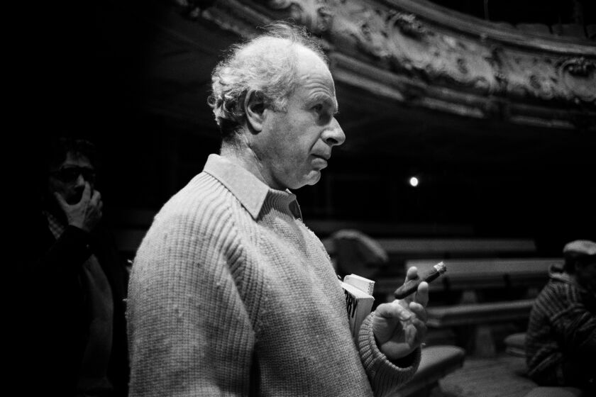 View of British theater director Peter Brook as he smokes a cigar during a rehearsal in the Theatre Bouffes du Nord, Paris, France, 1978. (Photo by Derek Hudson/Getty Images)