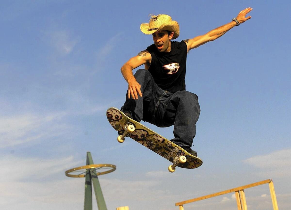 Christian skateboarder Anthony Carney of Orange goes flying as he goes over a jump at Edison Field during an exhibition at the Anaheim Harvest Crusade in 2001.
