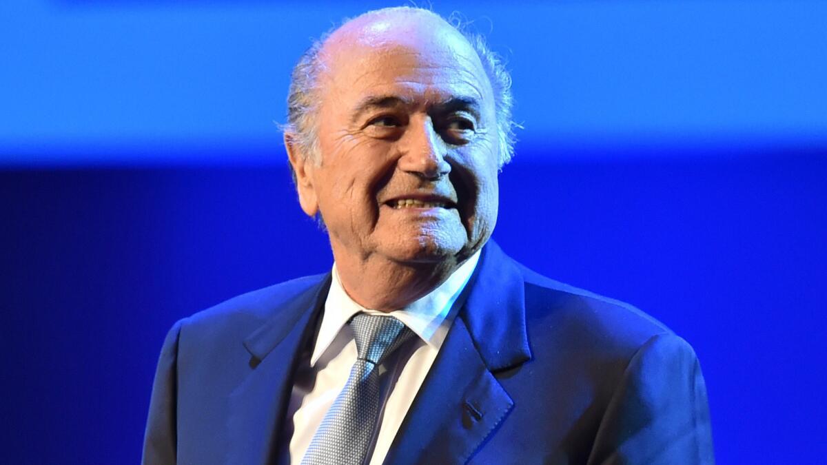 FIFA President Sepp Blatter stands on stage during the opening ceremony of the FIFA Congress in Sao Paulo, Brazil, on Tuesday. Blatter doesn't seem bothered by the scandals he had faced during his tenure as president.