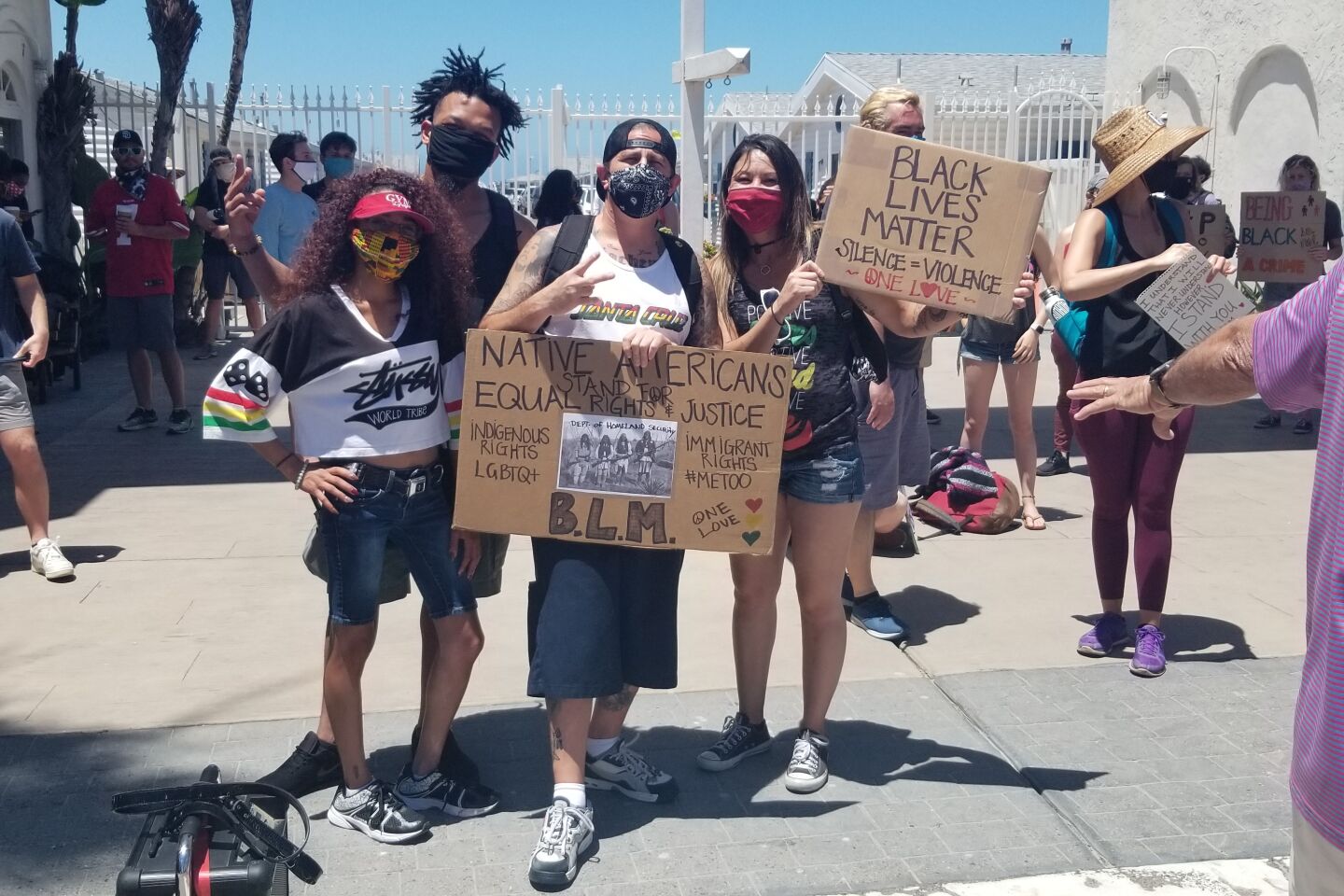 Protesters rally at the Pacific Beach Walk for Equality at Crystal Pier on June 14.