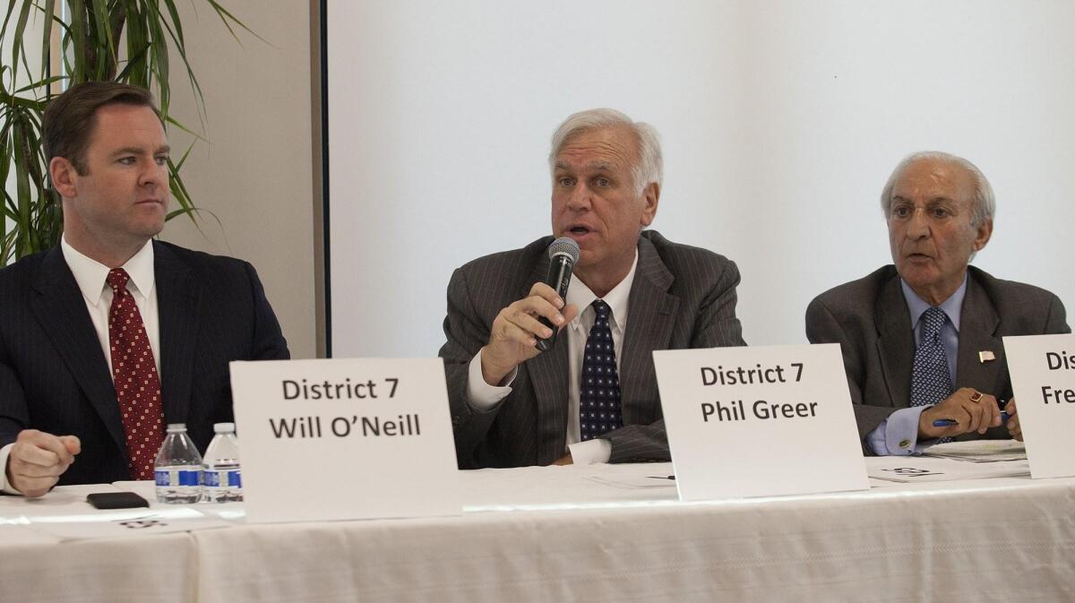 Newport Beach City Council District 7 candidates, from left, Will O’Neill, Phil Greer and Fred Ameri address questions during a West Newport Beach Assn. council candidate forum on Wednesday night at Marina Park in Newport Beach.