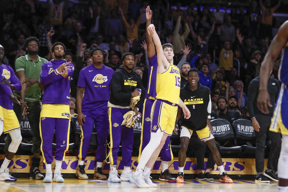 Lakers guard Austin Reaves makes a three-point shot against the Warriors in Game 4 of the Western Conference semifinals.