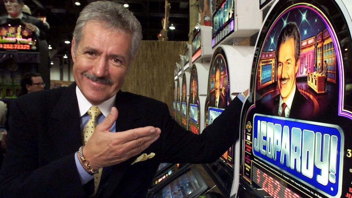 Alex Trebek in Las Vegas in 2000, showing off the new 'Jeopardy!' slot machines.