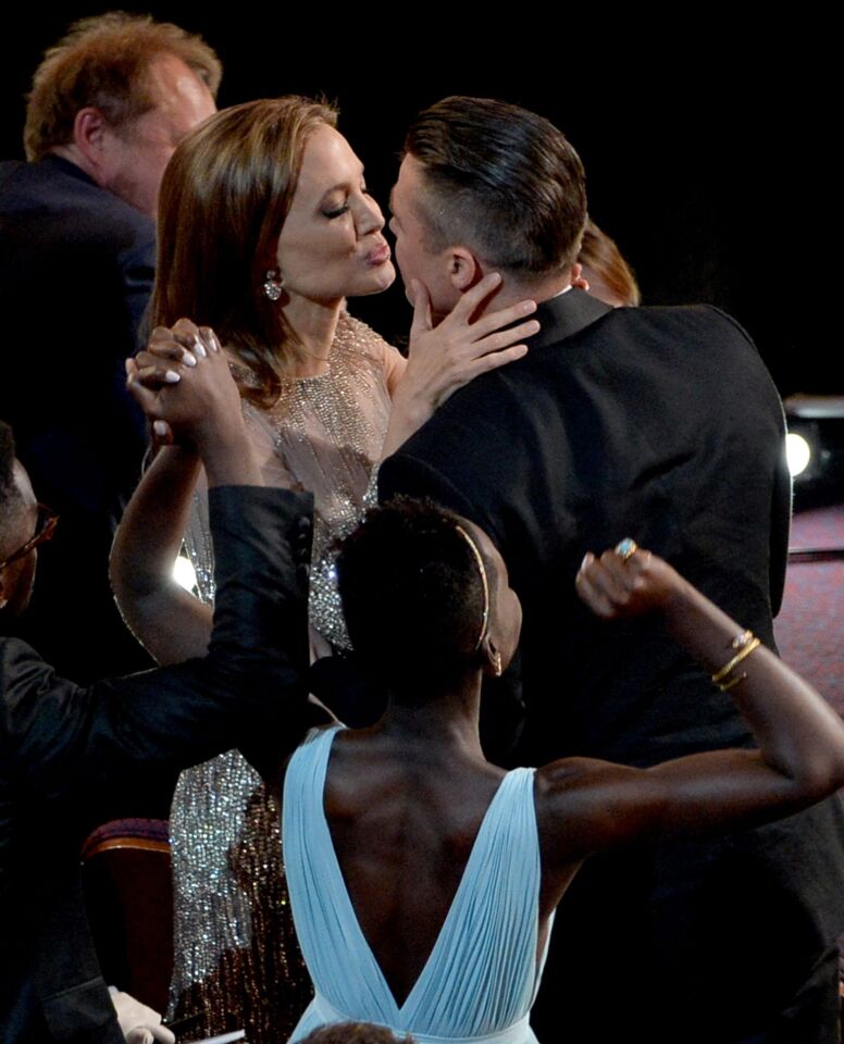 Jolie congratulates Pitt when "12 Years A Slave," which he produced and starred in, won the Academy Award for best picture.