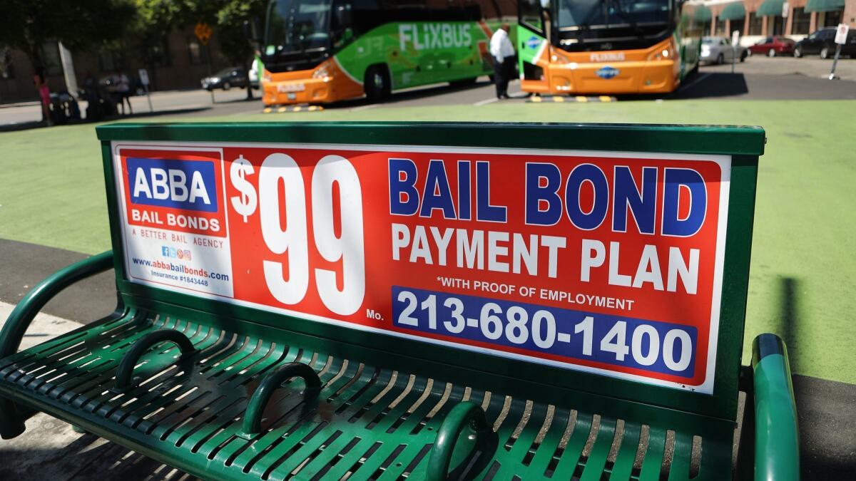 A sign advertises a bail bond company on Aug. 29 in L.A. California has ended its money bail system.