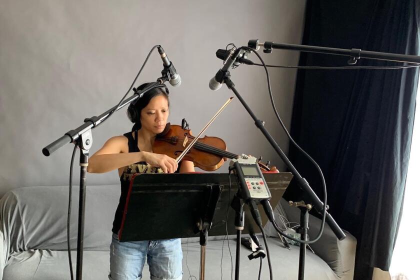 Violinist Melissa Tong recording music for American Opera Project from home.