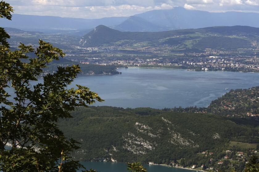 FILE - View of the lake of Annecy, French Alps, Friday, Sept.10, 2010. France's interior minister Gerald Darmanin says Thursday June 8, 2023 that an attacker with a knife injured children and others in a town in Annecy, French Alps. In a short tweet, he said police have detained the attacker. (AP Photo/Lionel Cironneau, File)