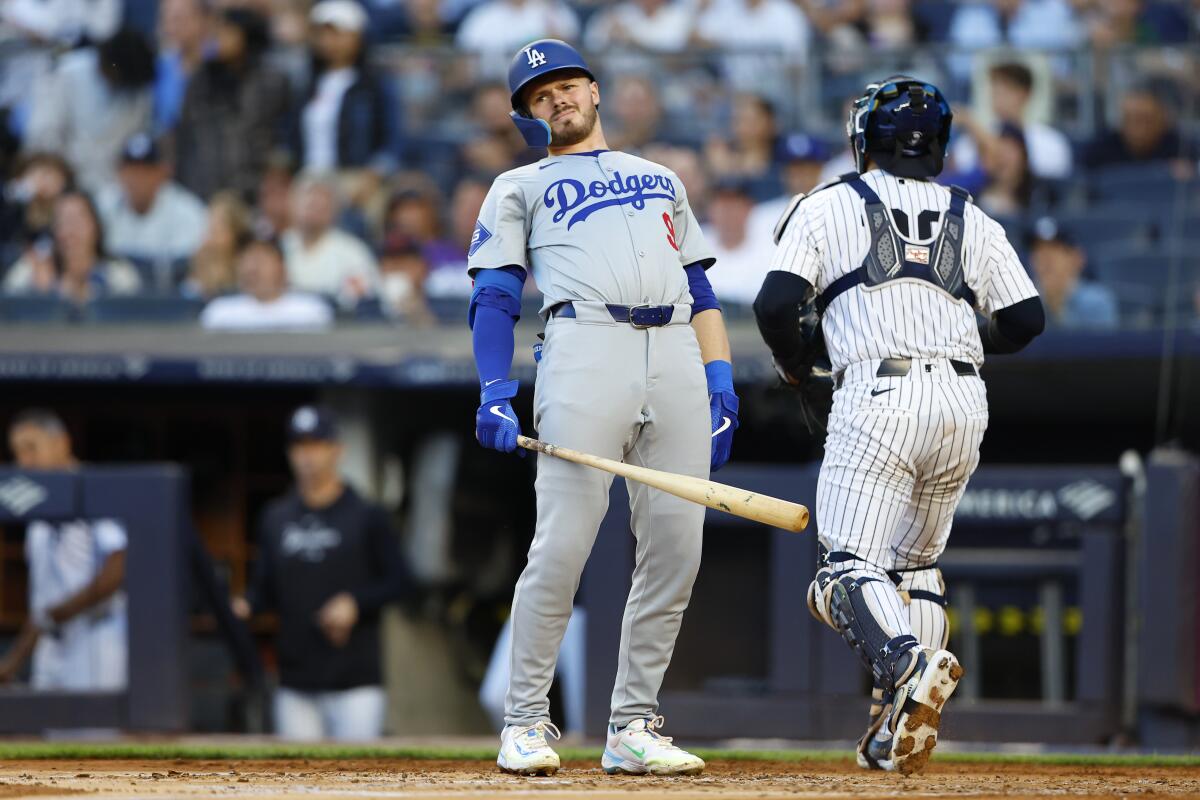 Dodgers batter Gavin Lux reacts after being called out on strikes in the second inning Sunday.