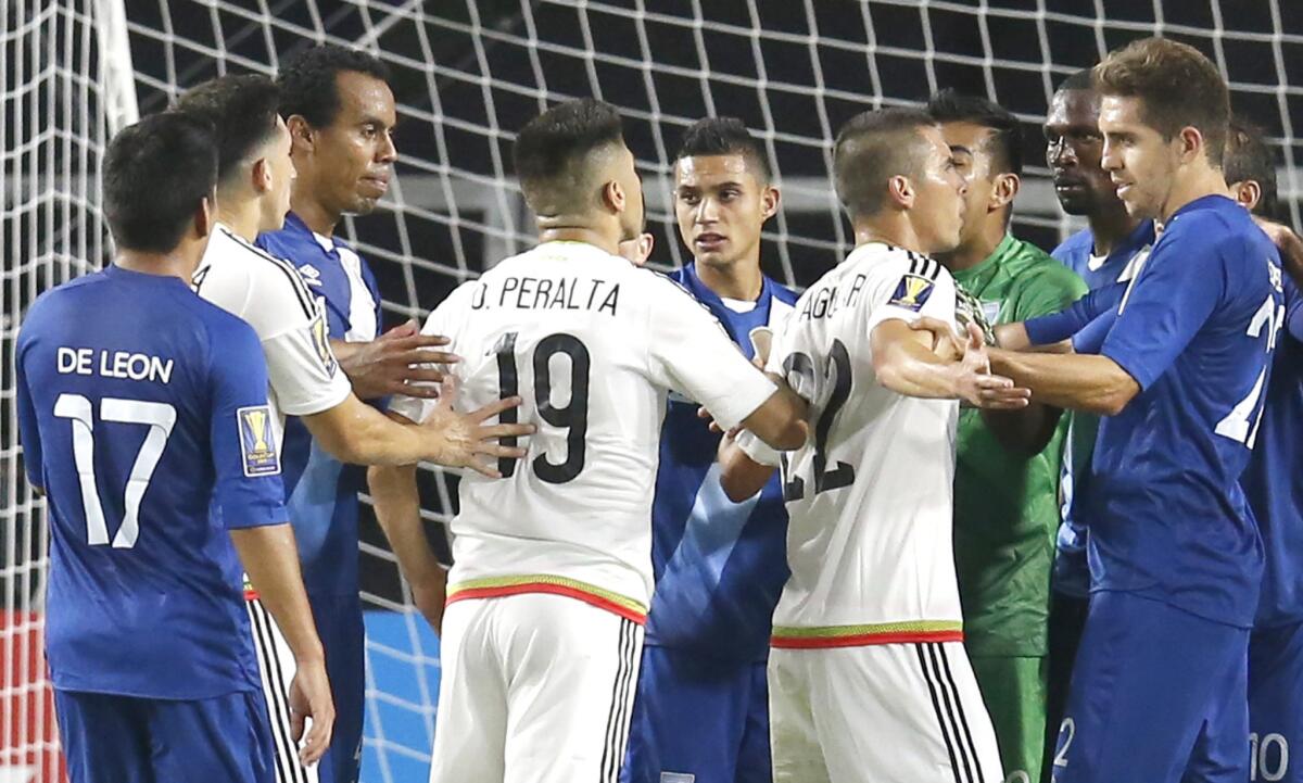 Mexico and Guatemala players get into a scuffle during the second half of a CONCACAF Gold Cup match. The teams tied, 0-0.