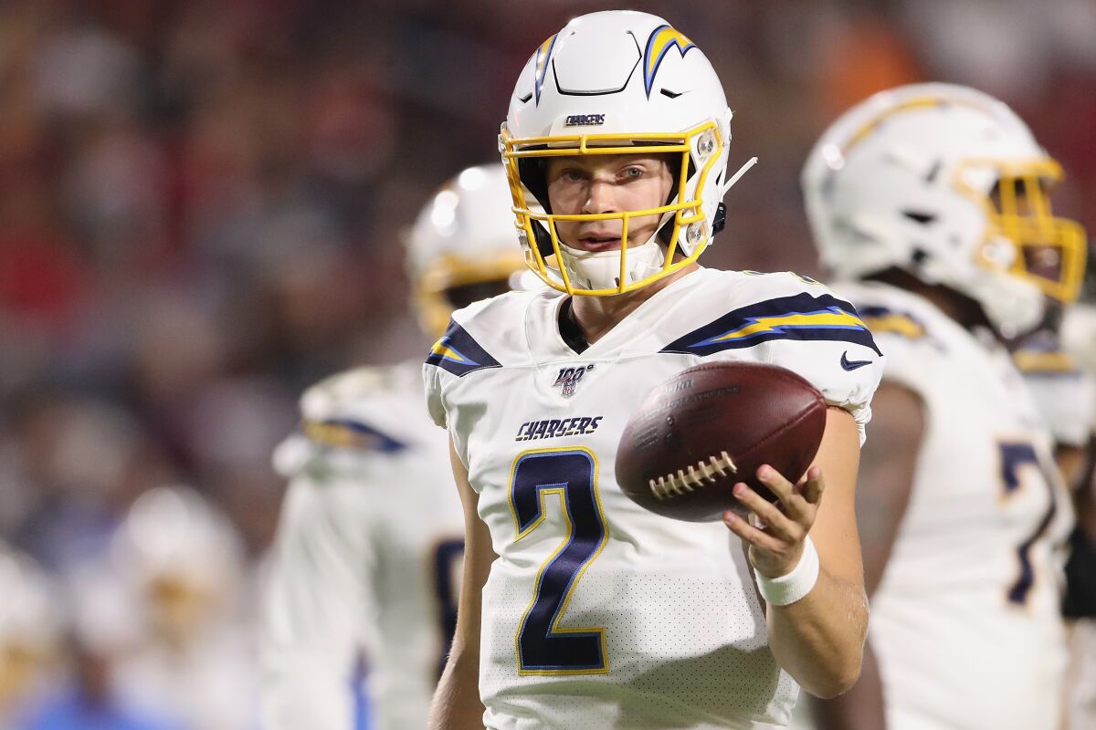 Chargers quarterback Easton Stick warms up before a preseason game against the Arizona Cardinals in August.