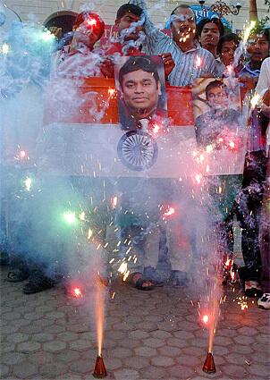 Fans in Bhopal, India celebrate composer A. R. Rahman's Oscar victories, which include best original song, 'Jai Ho,' and best original soundtrack.