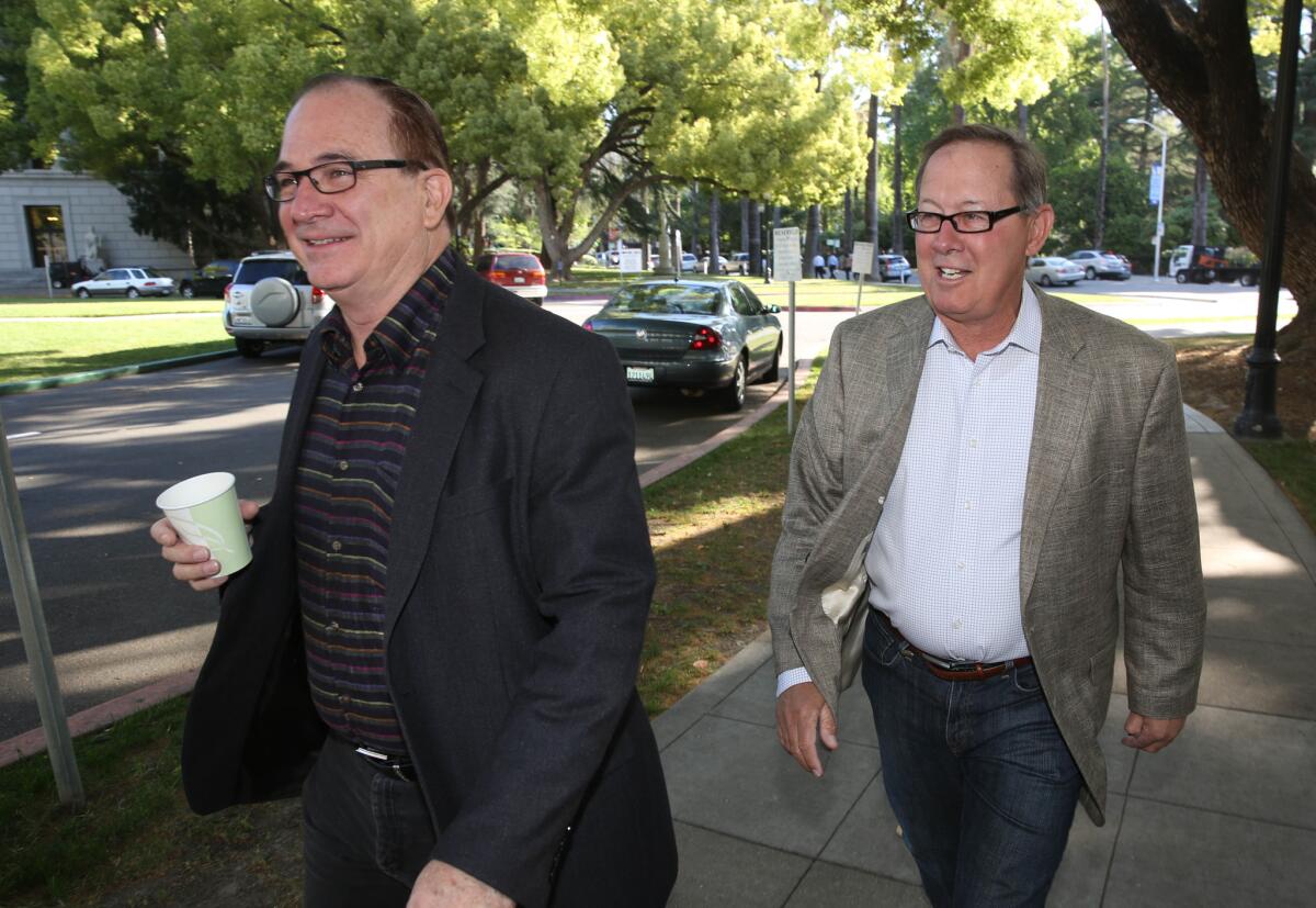 Robert Huff (R-Diamond Bar), left, and Sen. Tom Berryhill (R-Modesto) walk to a recent ethics training session. The two are among 11 Republican senators who proposed new ethics rules Wednesday.