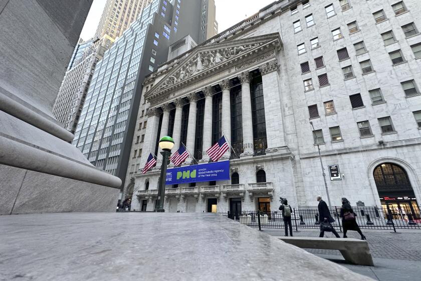 Pedestrians pass the New York Stock Exchange on Tuesday, Feb. 20, 2024 in New York. (AP Photo/Peter Morgan)