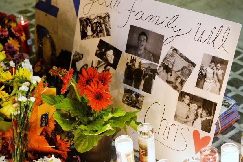 A memorial was set up for shooting victim Christopher Michaels-Martinez outside the I.V. Deli Mart in Isla Vista, where he was shot and killed Friday night.