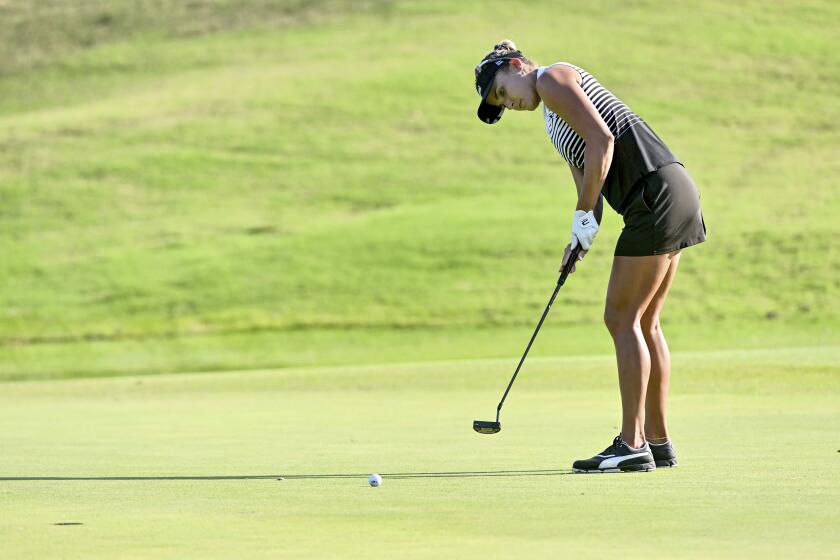 CORRECTS TO 2023 NOT 2022 - Lexi Thompson putts the ball on the third green during the first round of the LPGA Walmart NW Arkansas Championship golf tournament, Friday, Sept. 29, 2023, in Rogers, Ark. (AP Photo/Michael Woods)