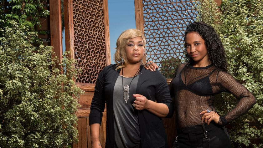 The surviving members of TLC, Tionne "T-Boz" Watkins, left, and Rozonda "Chilli" Thomas. (Christina House / For The Times)