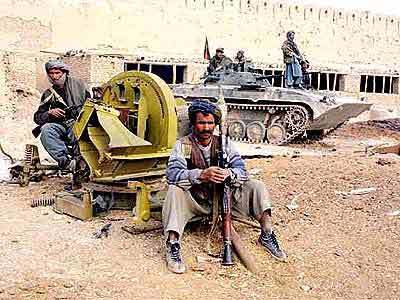 Northern Alliance fighters rest after days of combat in the fortress prison near Mazar-i-Sharif.