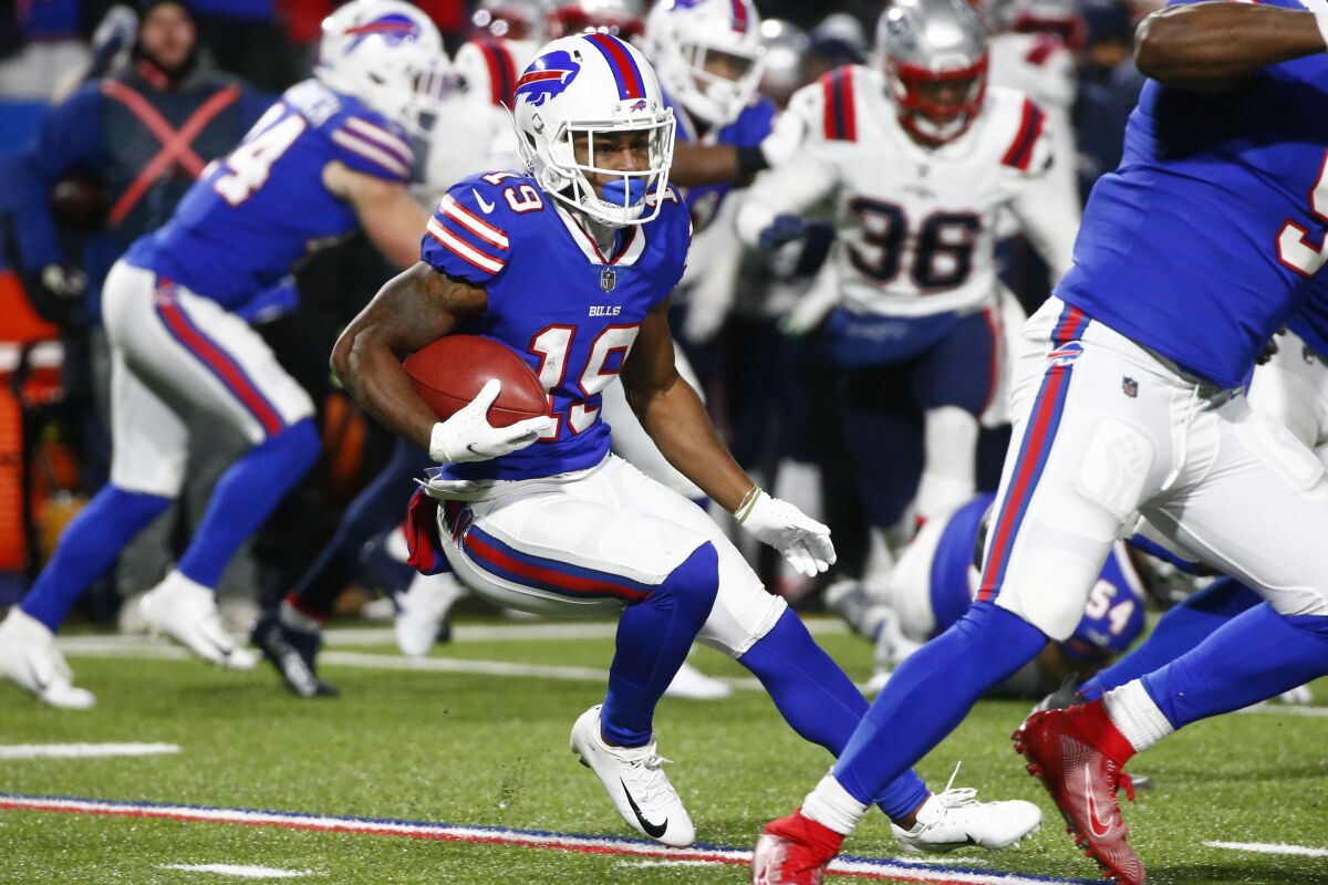 FILE - Buffalo Bills wide receiver Isaiah McKenzie (19) carries the ball during the second half of an NFL wild-card playoff football game against the New England Patriots in Orchard Park, N.Y., Saturday, Jan. 15, 2022. GeoComply Solutions, the Vancouver, Canada-based tech company, recorded 17.9 million transactions last weekend in New York, up from 17.2 million the weekend before, when it went live in the state. The data records the amount of times the company was called on to verify a customer’s location and is considered a good indicator for at least a minimum level of sports betting activity, more than 80% of which is done online in the U.S. (AP Photo/ Jeffrey T. Barnes)