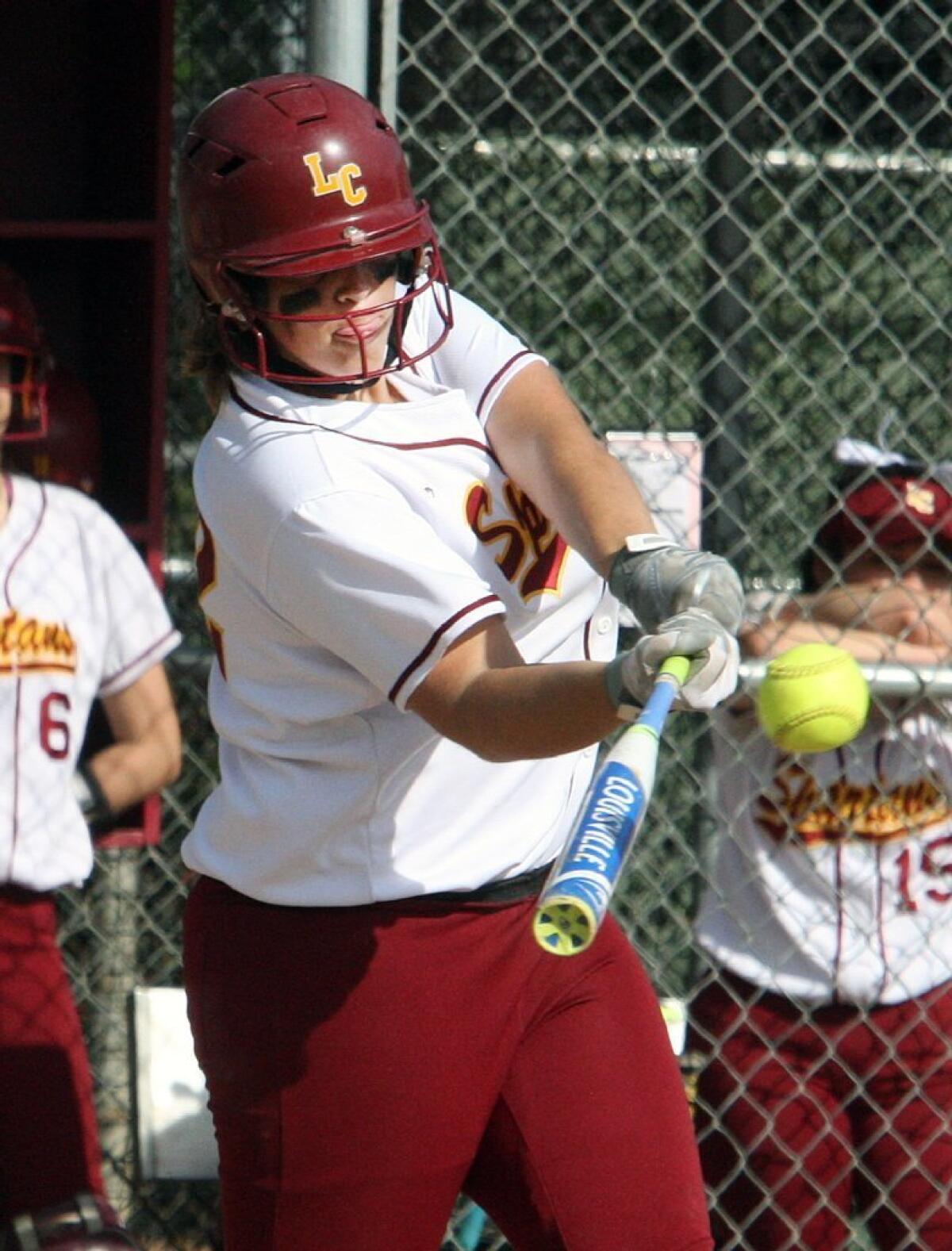 La Cañada's Gillian Arnold hits an RBI double against Monrovia in the Spartans' 7-2 win on Friday.