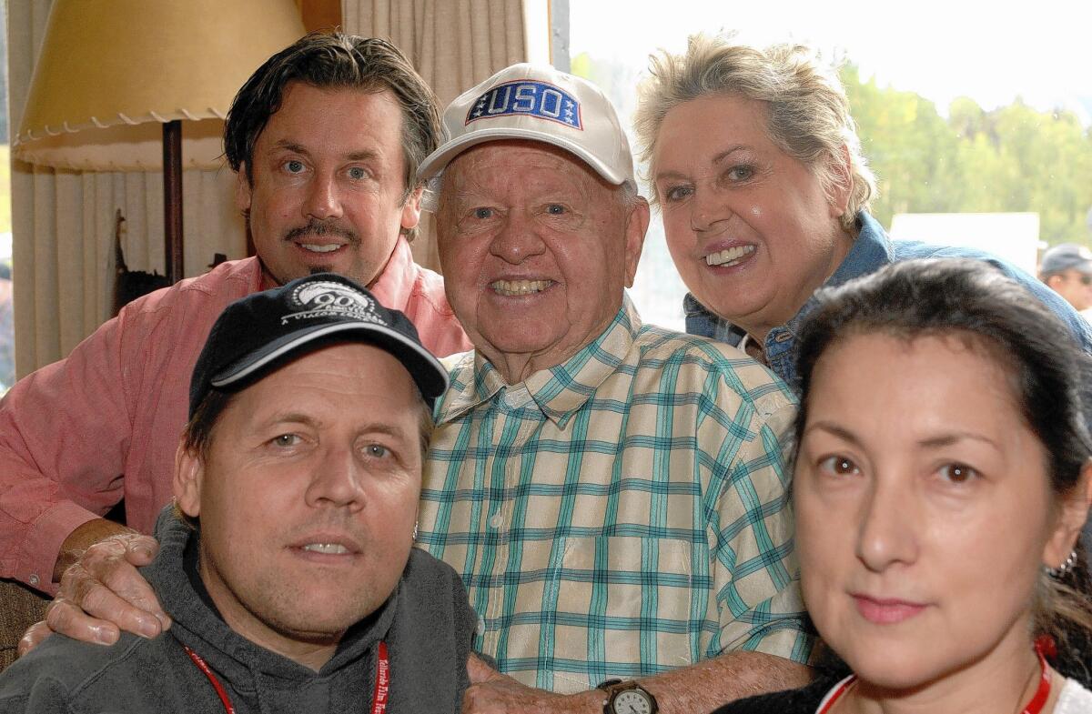 Mickey Rooney with his family, clockwise from upper left, son Chris, wife Jan, daughter-in-law Charlene and son Mark.