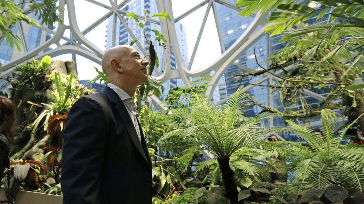 Jeff Bezos, the CEO and founder of Amazon.com, takes a walking tour of the Amazon Spheres, three plant-filed geodesic domes that serve as a work and gathering place for Amazon employees in Seattle.
