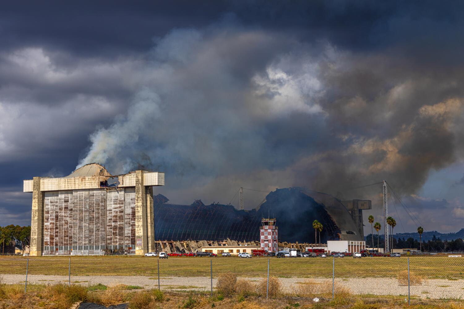 Massive Tustin hangar reignites just days after initial blaze spewed asbestos and lead