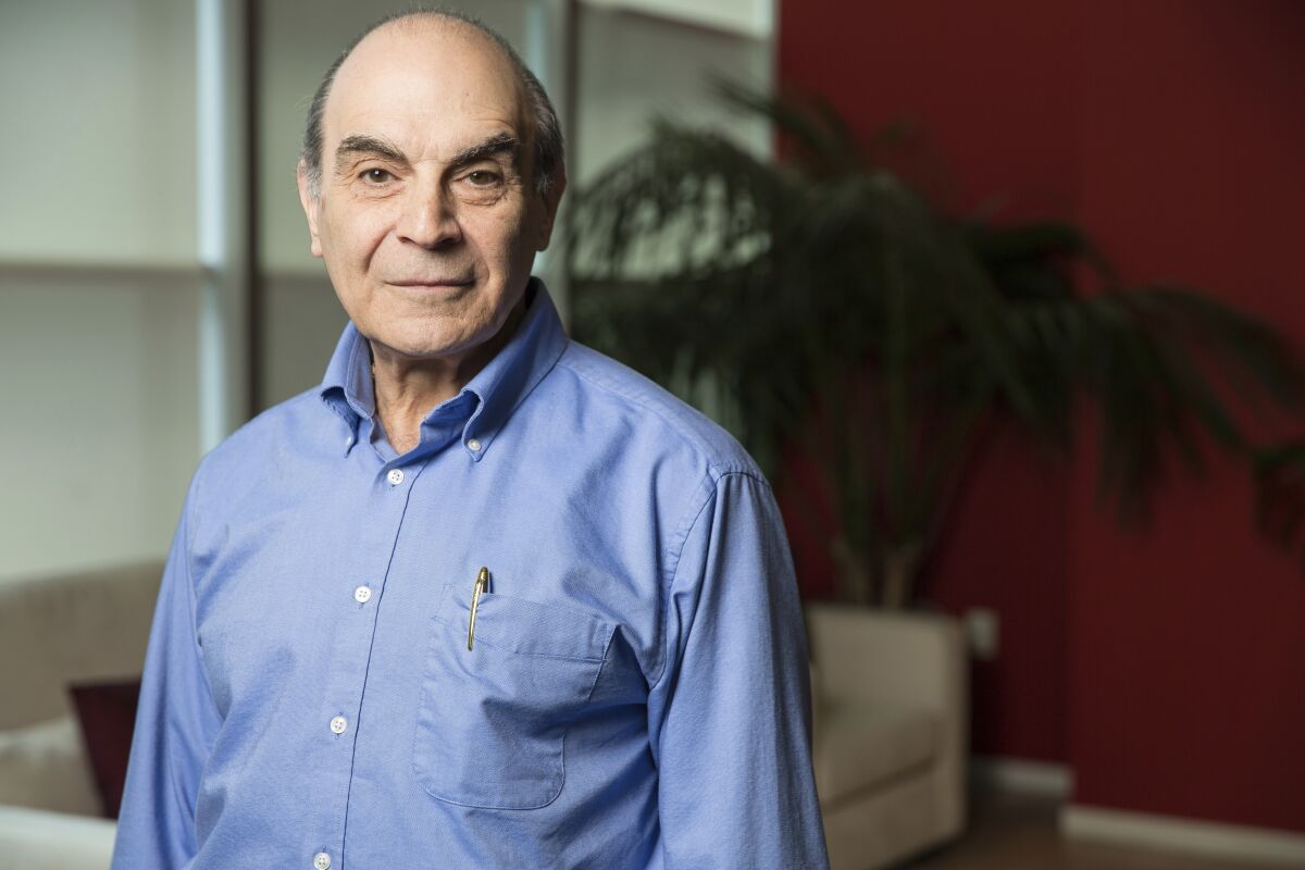 FILE - In this Friday, June 27, 2014 filephoto, David Suchet poses for a portrait during an interview in Los Angeles. Suchet, who played Agatha Christie's Hercule Poirot on television for almost 25 years has been knighted for services to entertainment in the Queen's Birthday honor list, it was announced late Friday, Oct. 9, 2020. (Photo by Casey Curry/Invision/AP, File)