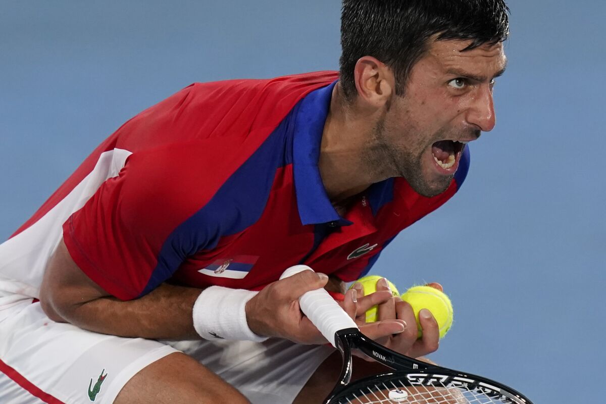 Novak Djokovic reacts during a semifinal loss to Alexander Zverev at the Tokyo Olympics.