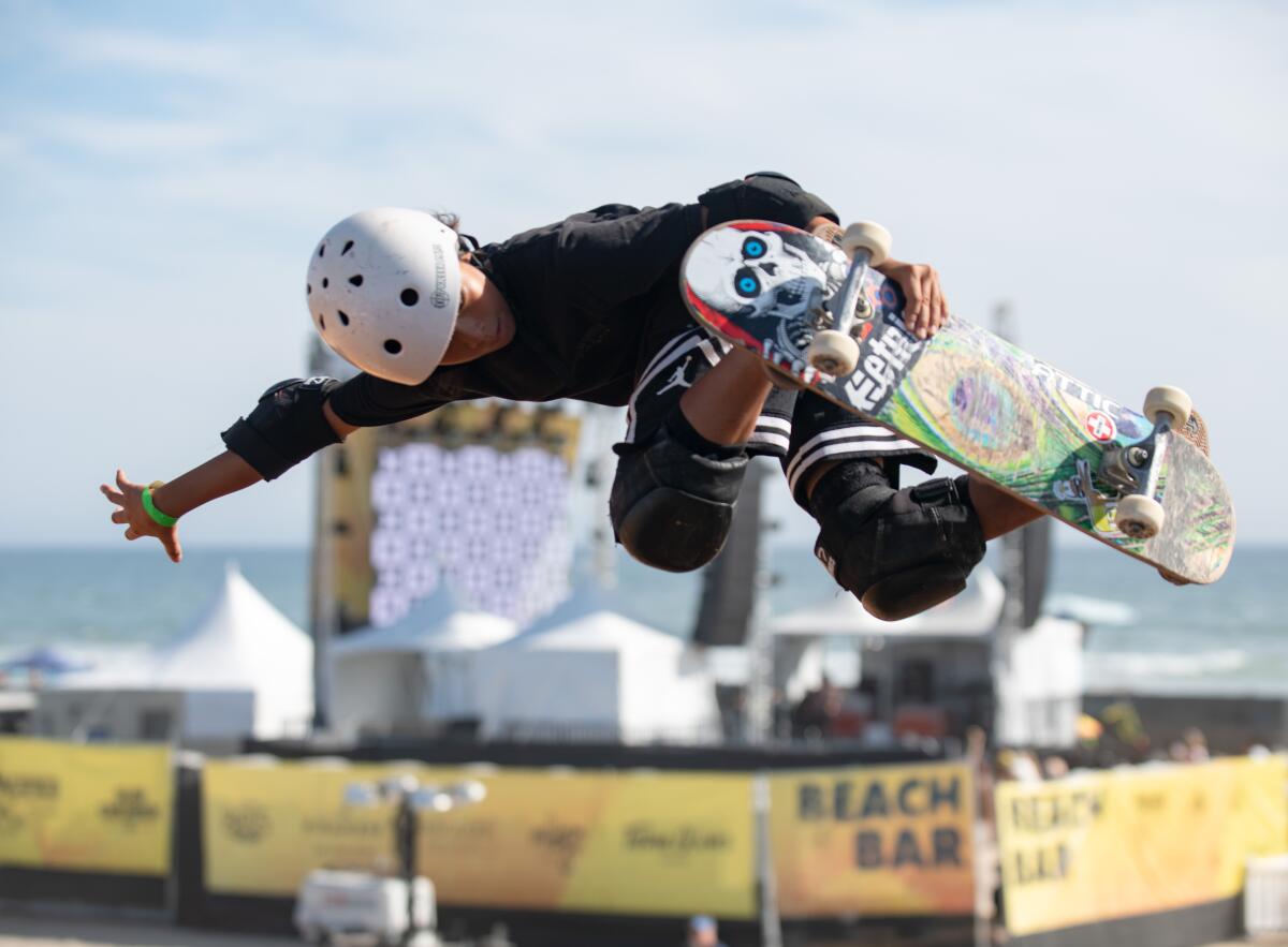 Shion Suganami sails over a vert ramp built on the sand just south of Huntington Beach Pier Sunday, Aug. 3.