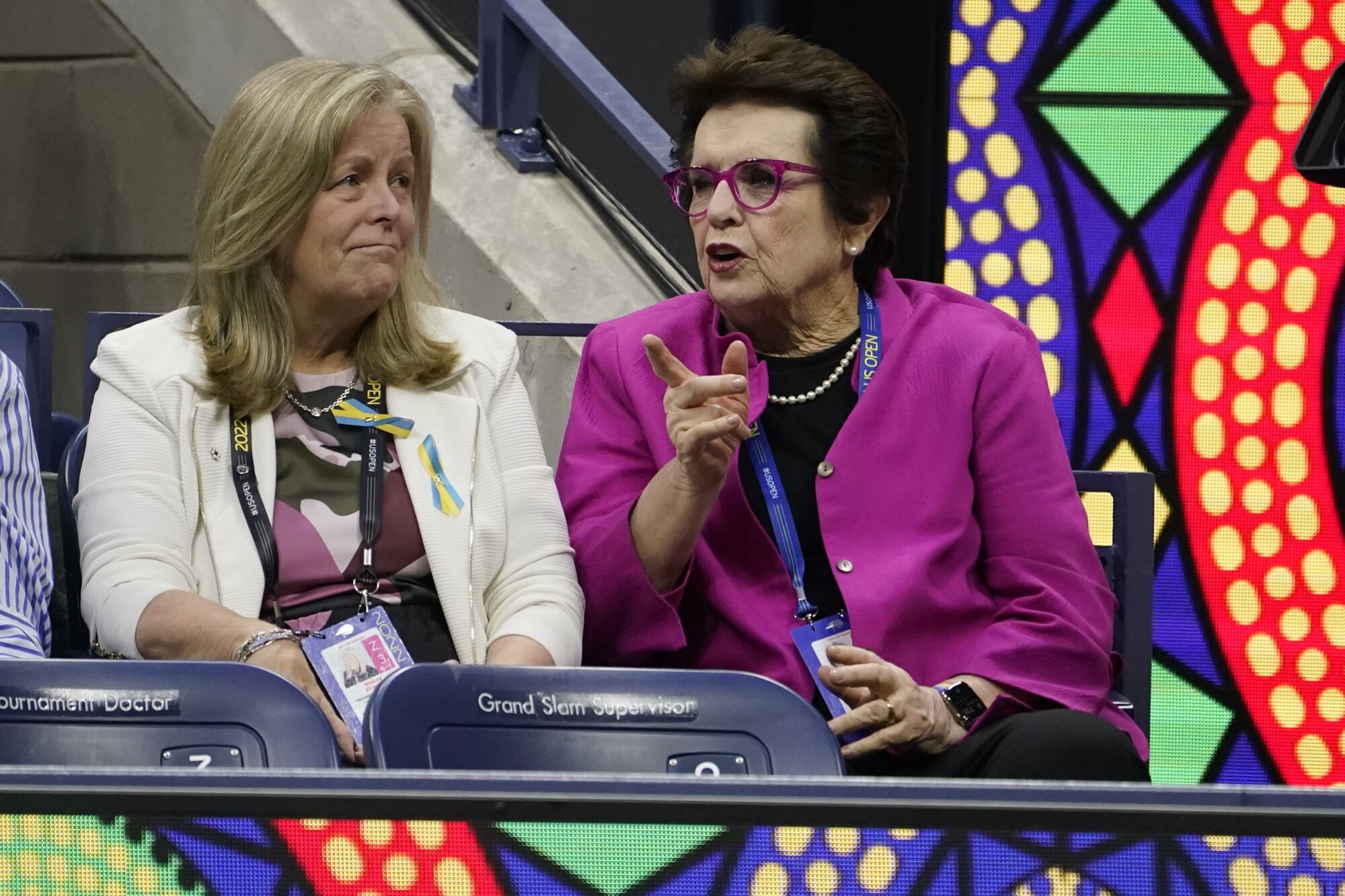 Billie Jean King sits in the stands during a match between Serena Williams and Anett Kontaveit.