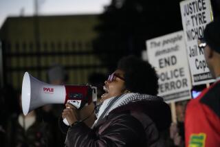 Amber Sherman speaks as protesters gather Friday, Jan. 27, 2023, in Memphis, Tenn., prior to a release of police video depicting five Memphis officers beating Tyre Nichols, whose death resulted in murder charges and provoked outrage at the country's latest instance of police brutality. (AP Photo/Gerald Herbert)