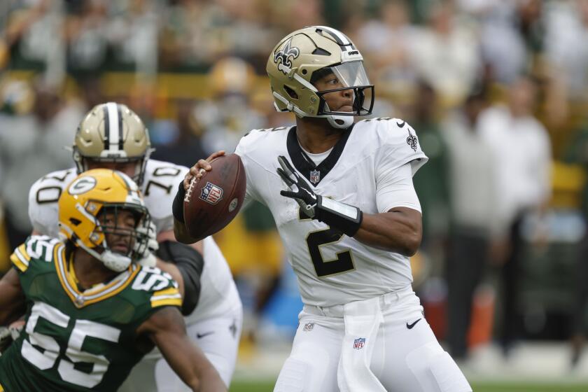 New Orleans Saints quarterback Jameis Winston (2) drops back to pass during the second half of an NFL football game against the Green Bay Packers Sunday, Sept. 24, 2023, in Green Bay, Wis. (AP Photo/Matt Ludtke)