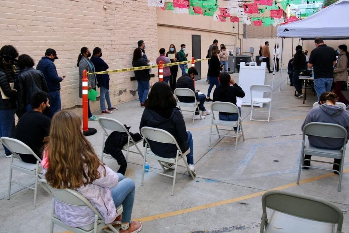 Parents of children waiting to receive their COVID-19 vaccines at the Mexican Consulate in Little Italy on Thursday, Nov. 5