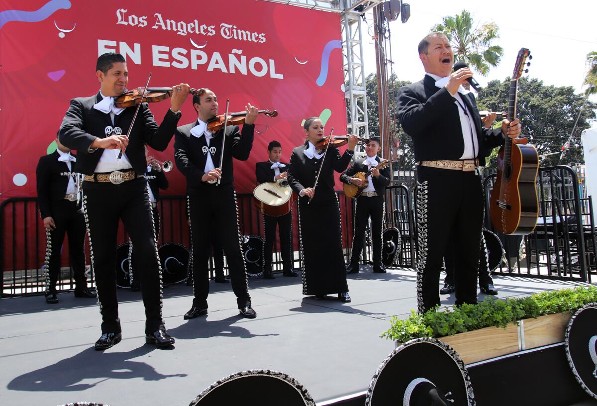 A mariachi band performs.