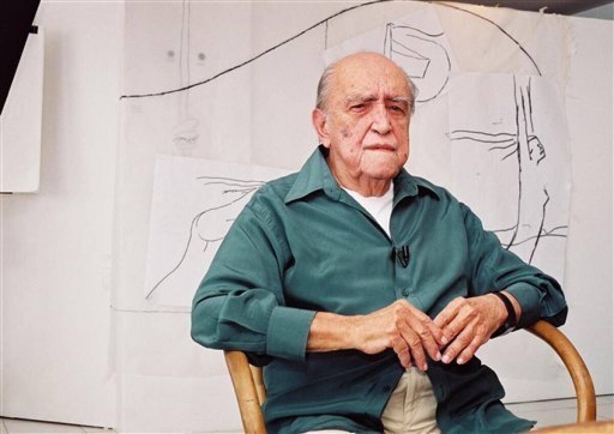 FILE - In this 2002 file photo, Brazilian architect Oscar Niemeyer sits during an interview in his office in Rio de Janeiro, Brazil. According to a hospital spokeswoman on Wednesday, Dec. 5, 2012, famed Brazilian architect Oscar Niemeyer has died at age 104. (AP Photo/Andre Luiz Mello, File)