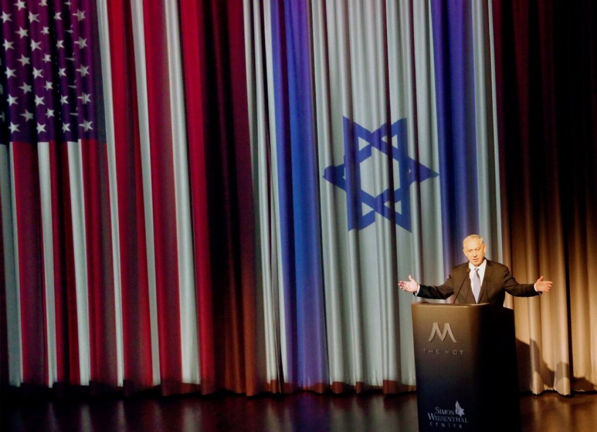 Israeli Prime Minister Benjamin Netanyahu, seen here giving a speech at the Simon Wiesenthal Center's Museum of Tolerance in Los Angeles, will speak to Congress on Tuesday about Iran.