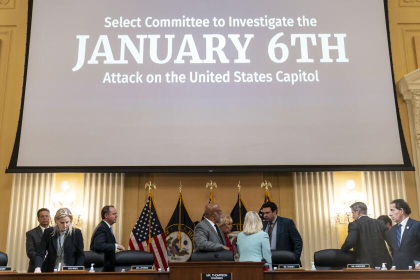 WASHINGTON, DC - JUNE 13: Committee members mull about as the committee breaks for recess during a House Select Committee to Investigate the January 6th hearing in the Cannon House Office Building on Monday, June 13, 2022 in Washington, DC. The bipartisan Select Committee to Investigate the January 6th Attack On the United States Capitol has spent nearly a year conducting more than 1,000 interviews, reviewed more than 140,000 documents day of the attack. (Kent Nishimura / Los Angeles Times)