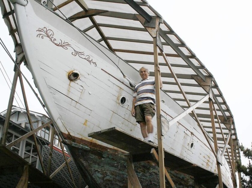 Dennis Holland, a Newport Beach resident, is restoring a 72-foot yact, the Shawnee, in his backyard.