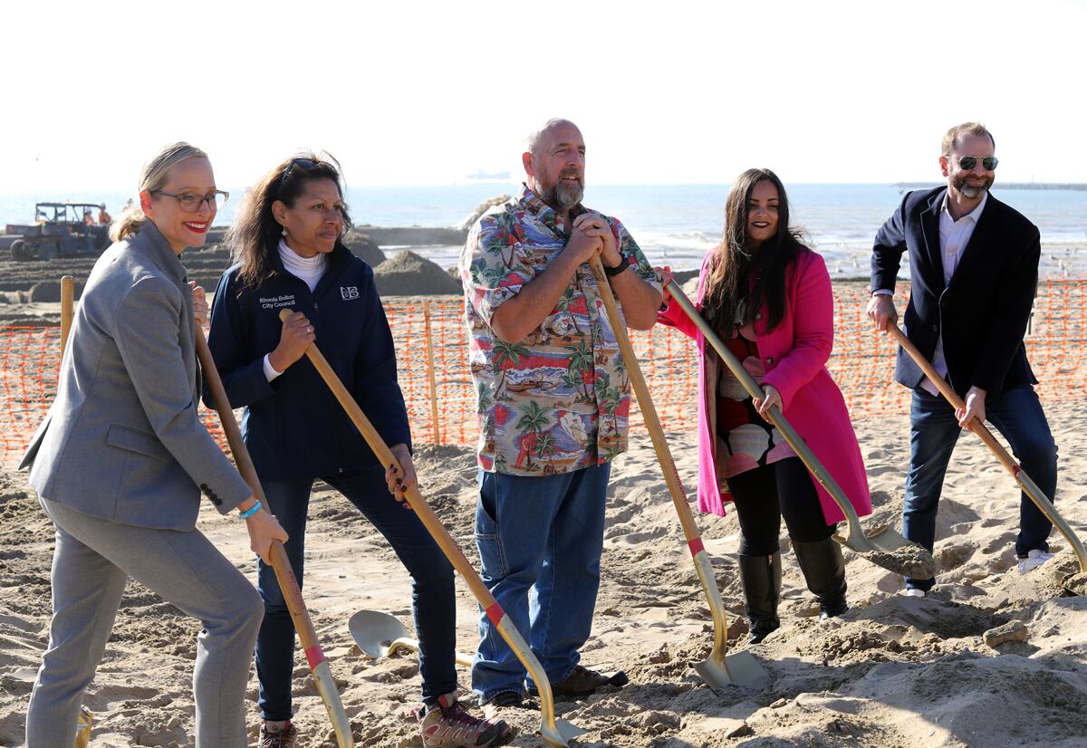 Members of the Huntington Beach City Council pose for photos during Wednesday's groundbreaking ceremony.