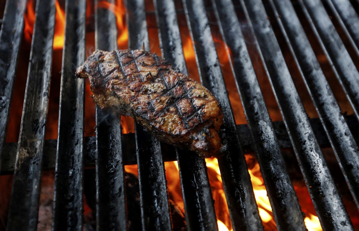 Steak on the grill at Salazar restaurant.