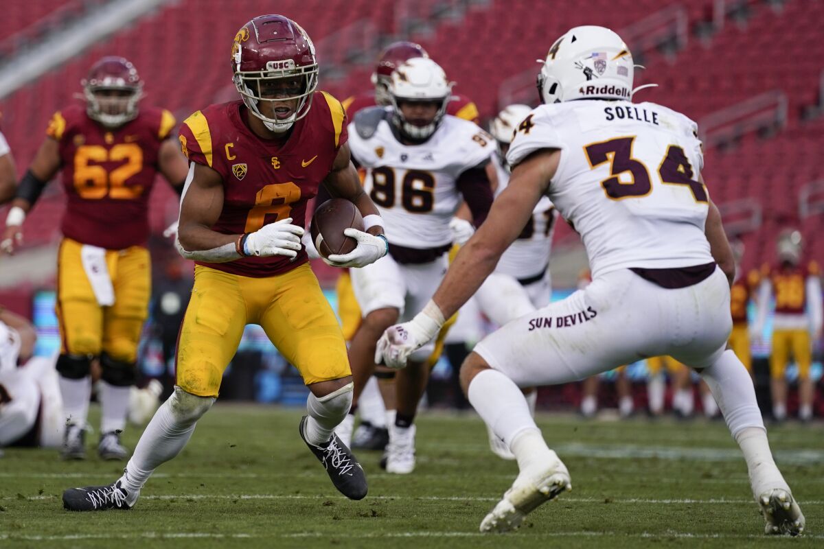 USC wide receiver Amon-ra St. Brown with the ball in front of Arizona State linebacker Kyle Soelle.