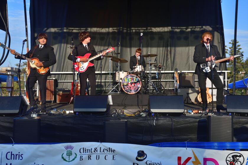 Beatles tribute performers play at Point Loma Community Park during the July 28 Beatles vs. Stones concert.