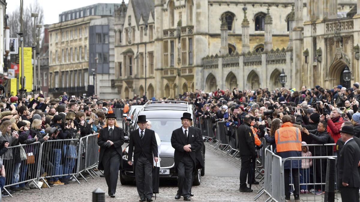 The hearse containing Stephen Hawking arrives at University Church of St. Mary the Great as mourners gather to pay their respects, in Cambridge, England, on Saturday.