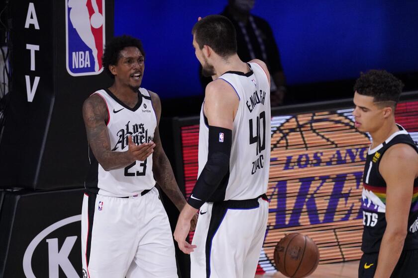 Los Angeles Clippers' Lou Williams (23) celebrates with Ivica Zubac (40) after Williams scored and got fouled during the second half of an NBA conference semifinal playoff basketball game against the Denver Nuggets, Wednesday, Sept. 9, 2020, in Lake Buena Vista, Fla. (AP Photo/Mark J. Terrill)