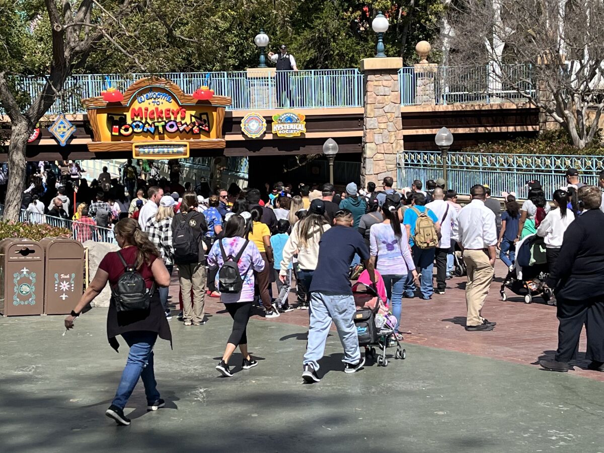 Disneyland guests head into the newly reopened Mickey's Toontown.