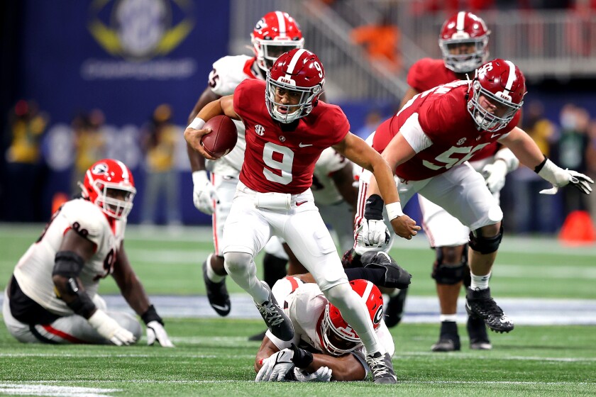 Alabama's Bryce Young runs against Georgia in the SEC title game